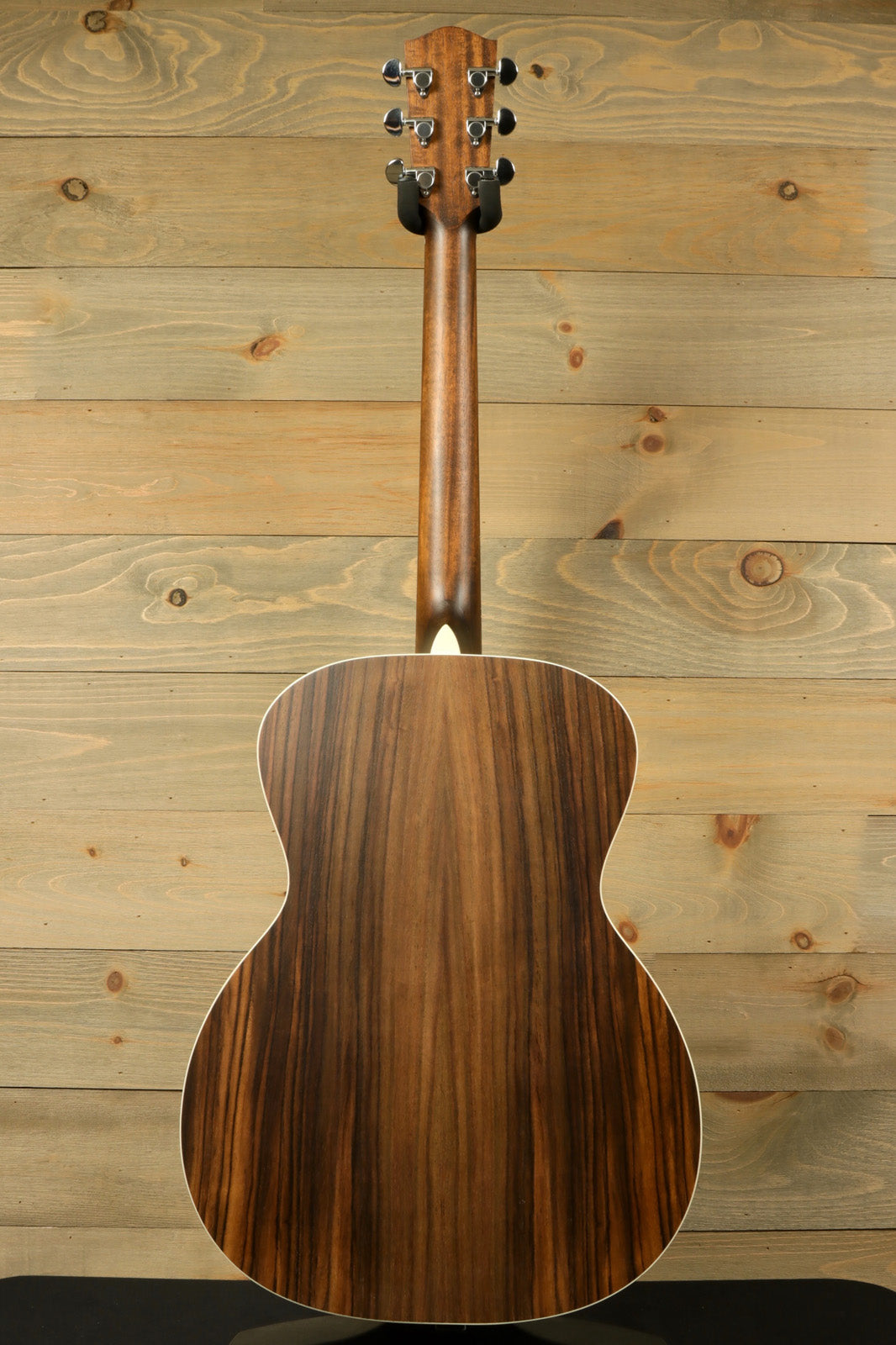 Eastman PCH2-OM-CLA acoustic guitar, natural wood finish, back view showcasing the elegant grain patterns