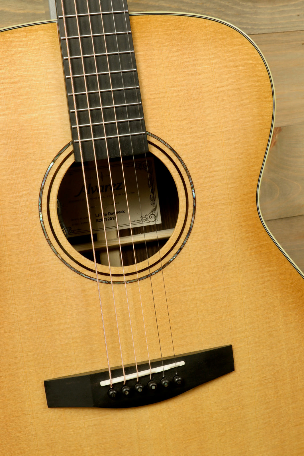 Alvarez LF70e Daybreak acoustic electric guitar in natural finish, front view showing fingerboard and soundhole