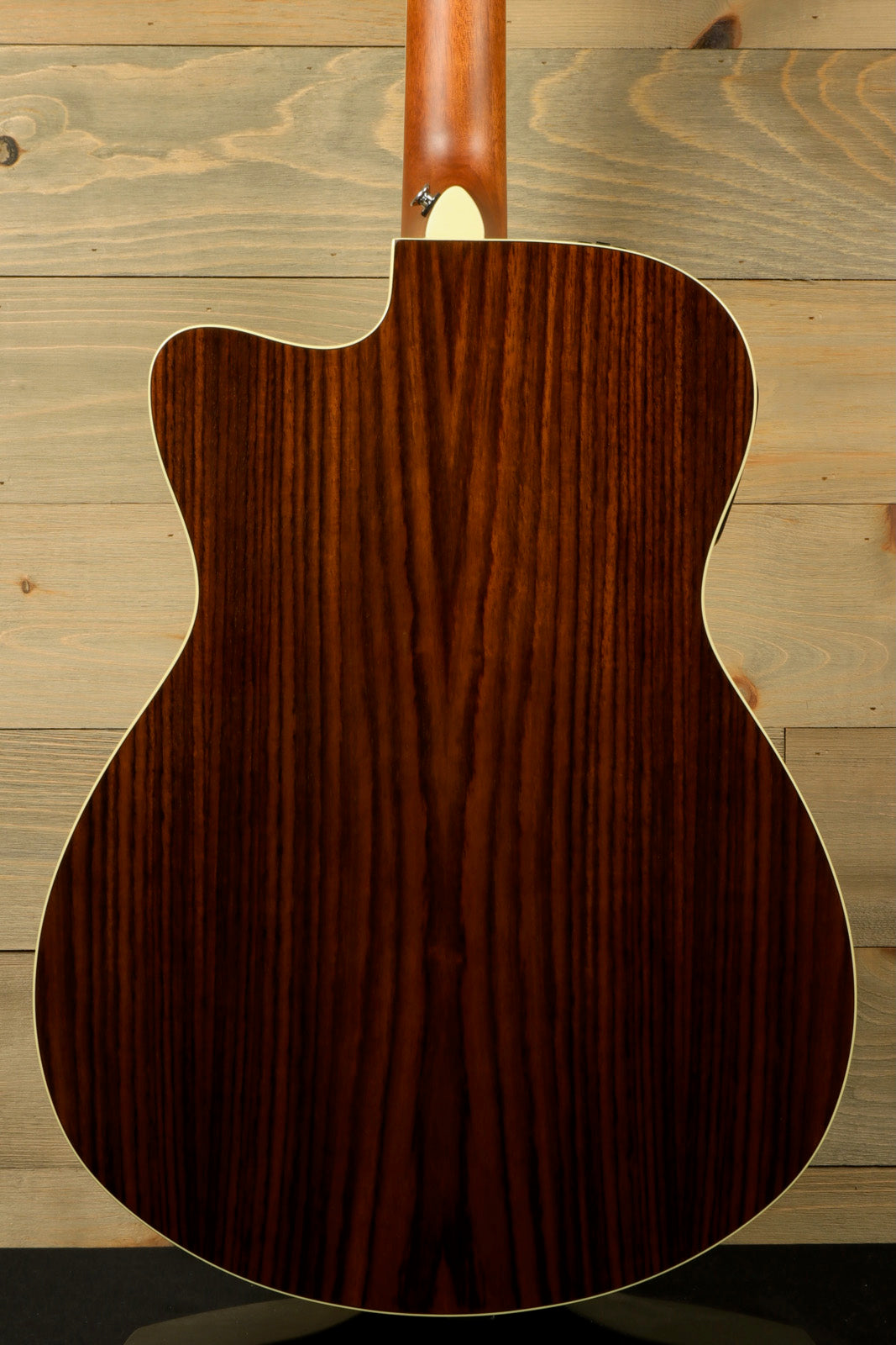 Yamaha acoustic electric guitar with a rich brown finish, back view highlighting wood grain
