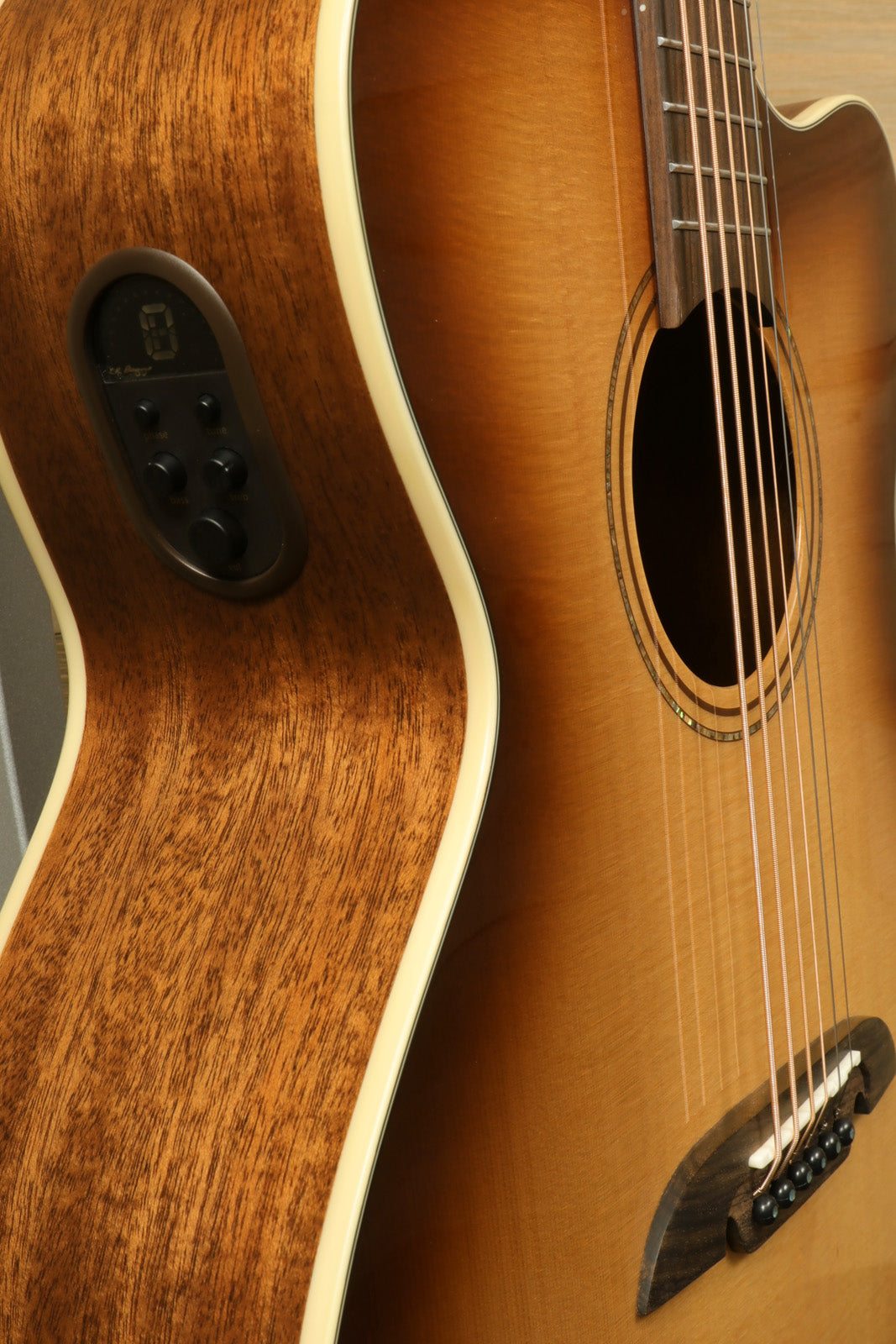 Alvarez Baritone Acoustic Electric Guitar, natural finish, side view showcasing electronics and wood grain