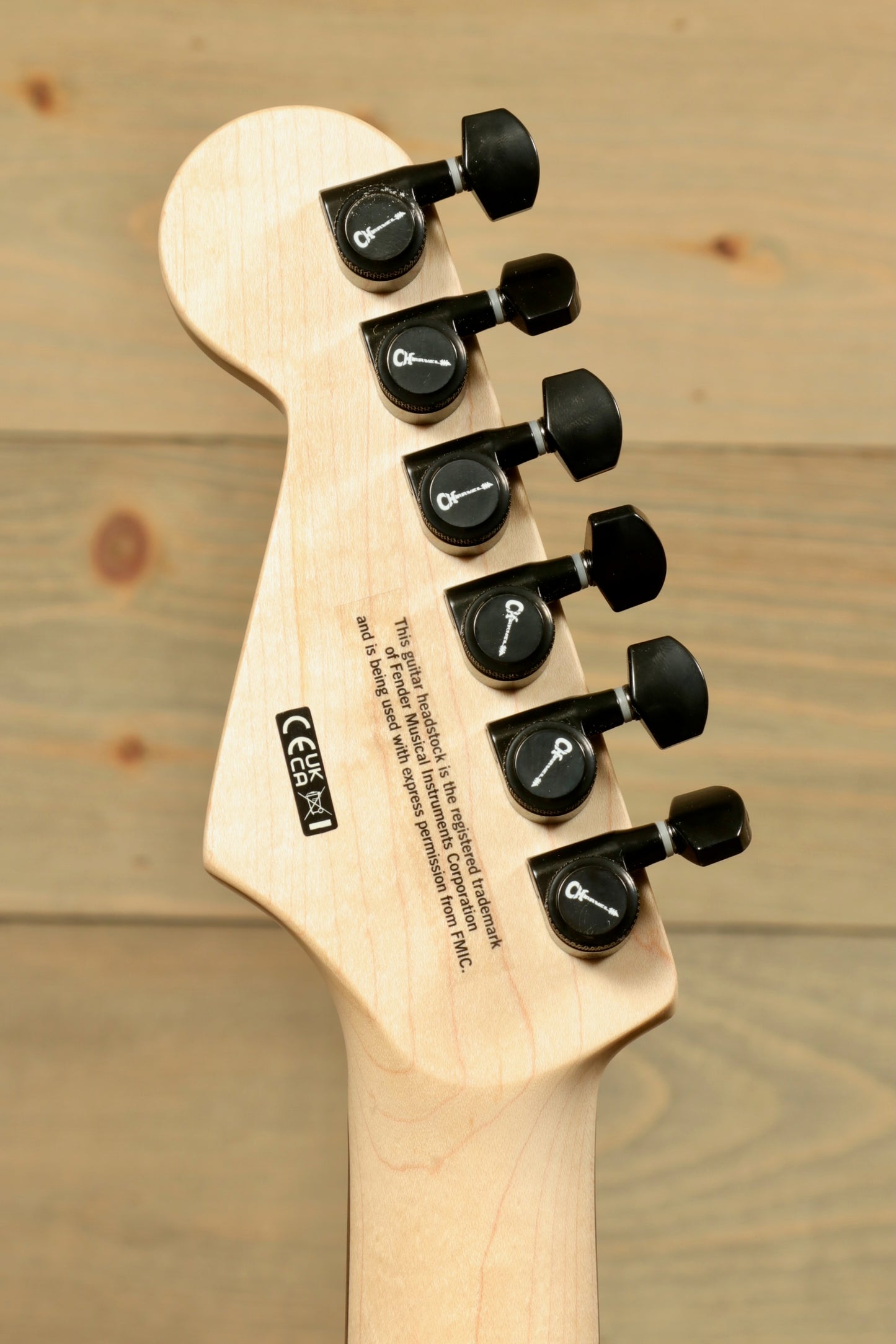 Headstock of Charvel Pro-Mod So-Cal electric guitar showing tuning pegs and detailed finish