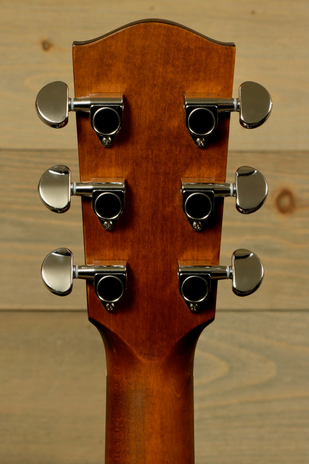 Eastman acoustic guitar headstock with chrome tuning pegs, back view showcasing fine craftsmanship