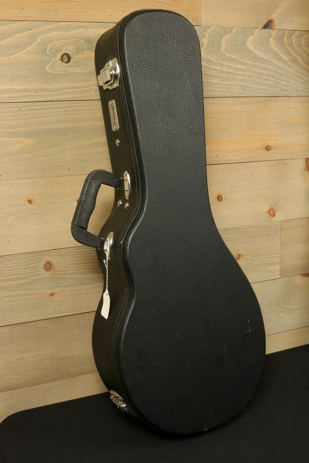 Eastman MD515/v with Hardshell Case - USED, black case side view on wooden background