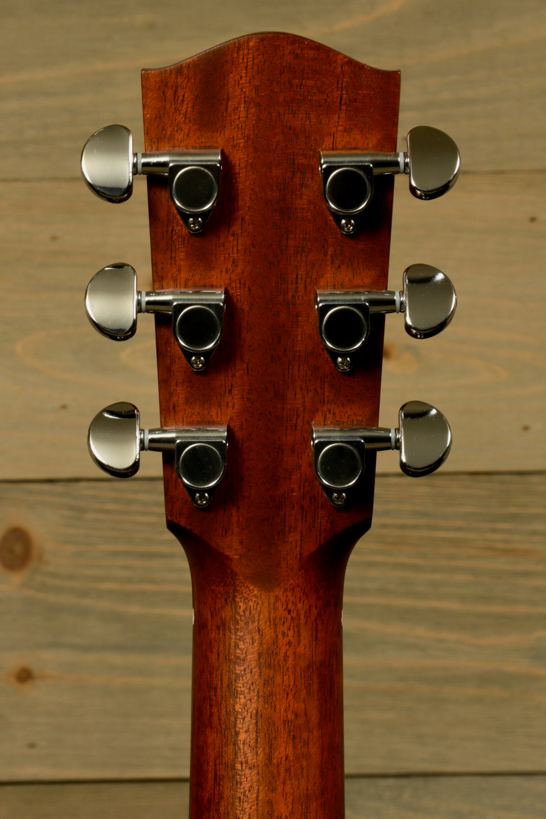 Eastman PCH1-OM acoustic guitar headstock in natural finish, rear view showing tuning pegs