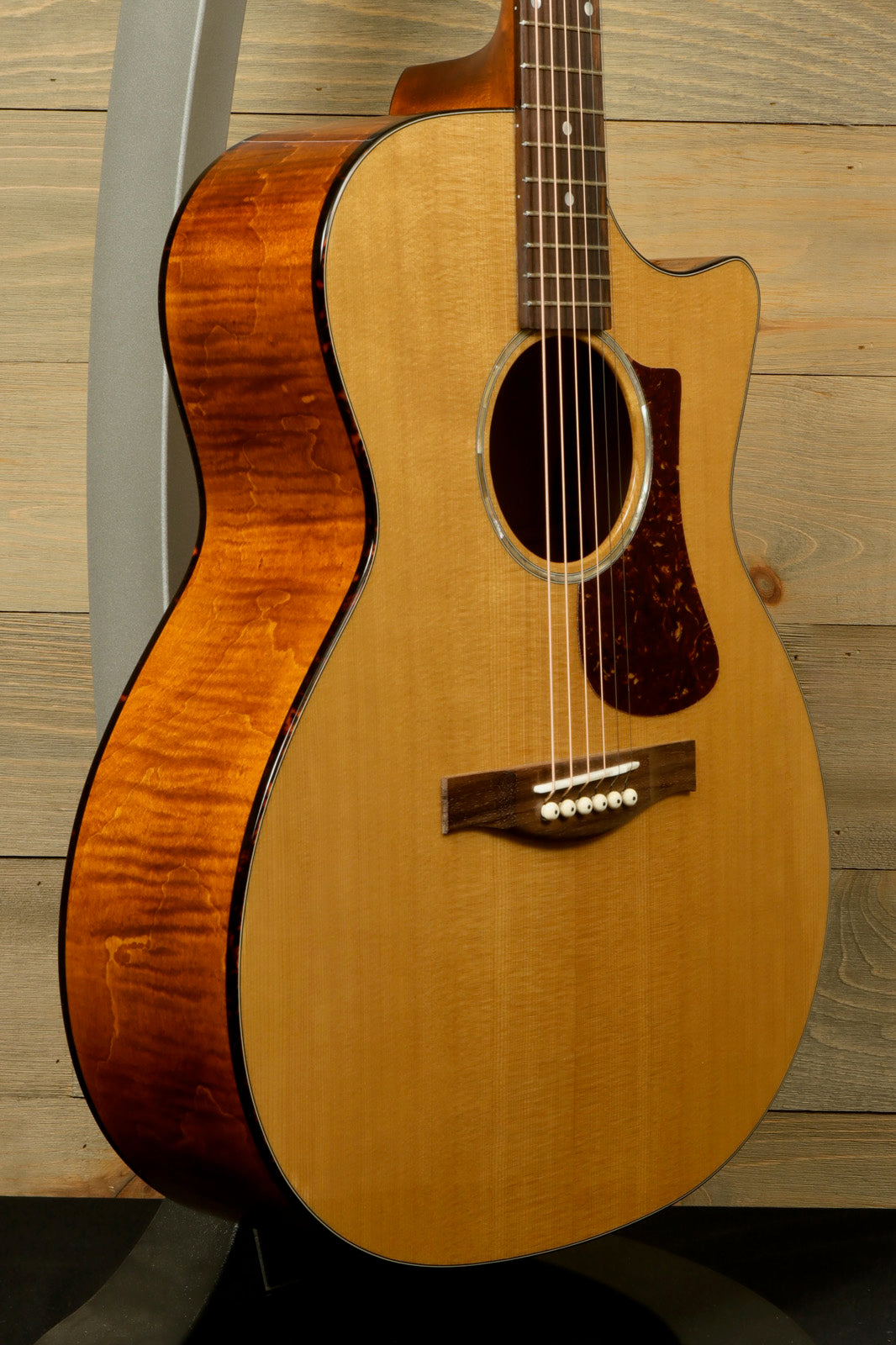 Eastman PCH3-GACE Amberburst Acoustic Guitar with natural finish, side view showcasing its elegant curves