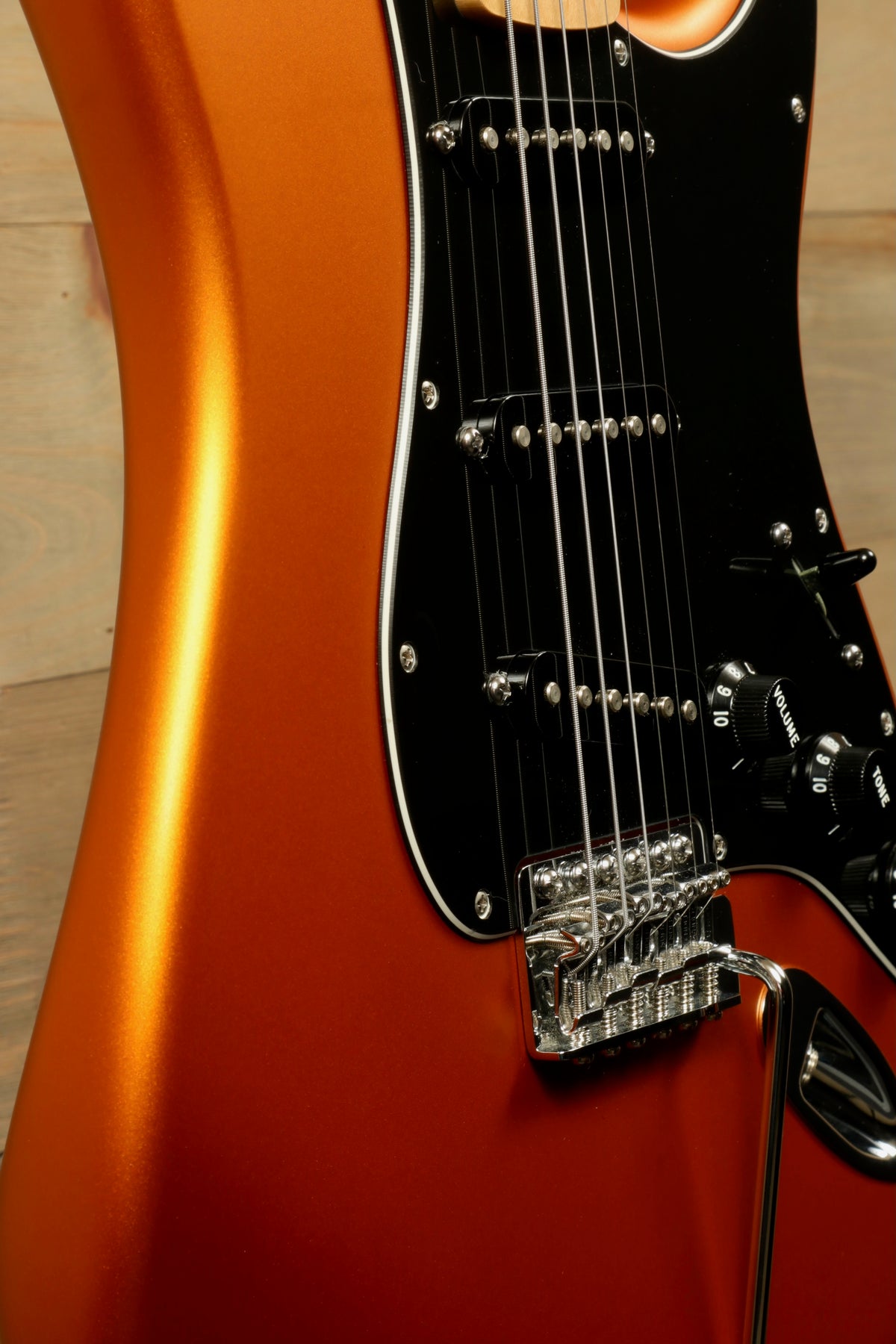 Fender Standard Stratocaster Satin Arizona Sun, close-up view highlighting the glossy orange finish