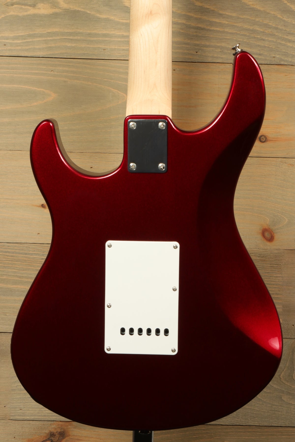 Yamaha PAC012 Pacifica Electric Guitar in shiny crimson red, back view showcasing the smooth finish