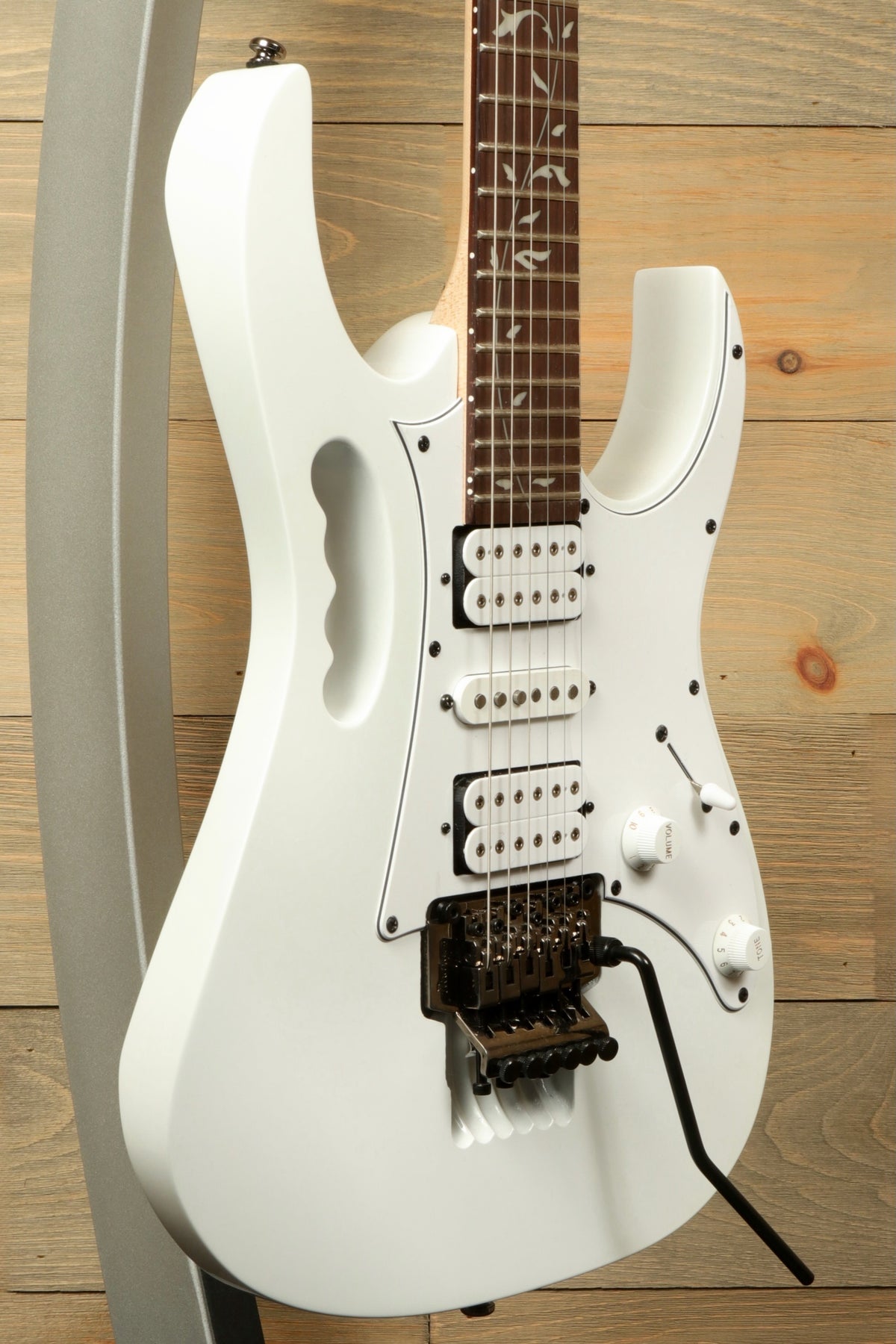 Ibanez JEMJR Steve Vai white electric guitar, side view with double cutaway design