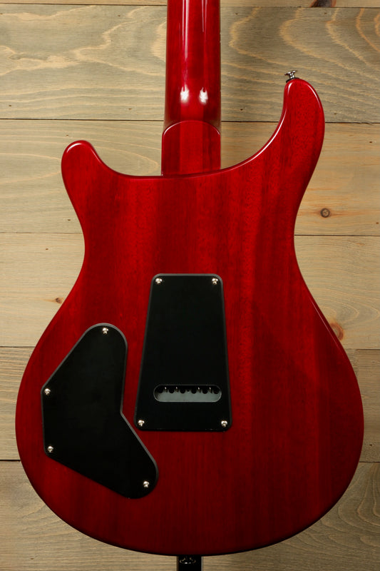 Back view of PRS SE DGT Standard guitar in vibrant red with sleek contours and black covers