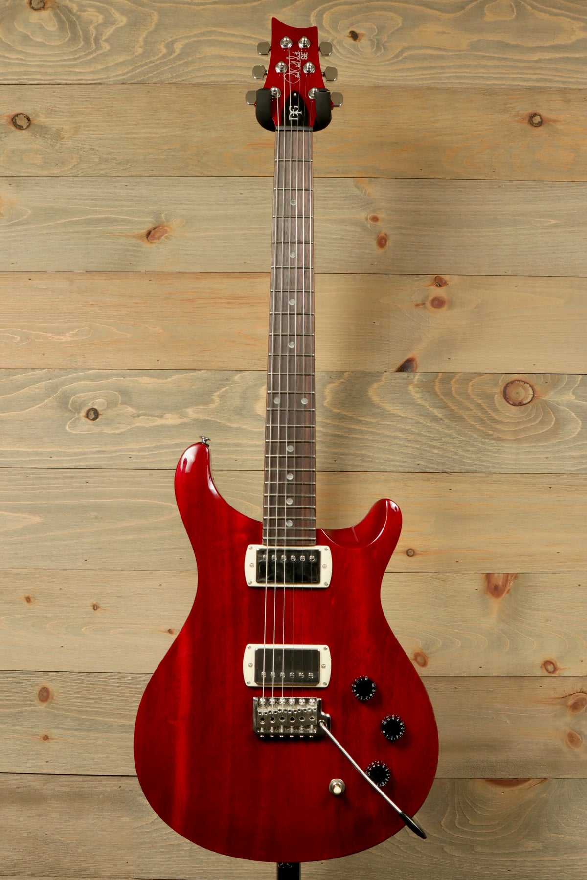 PRS SE DGT Standard guitar in glossy red finish with dual pickups and sleek design