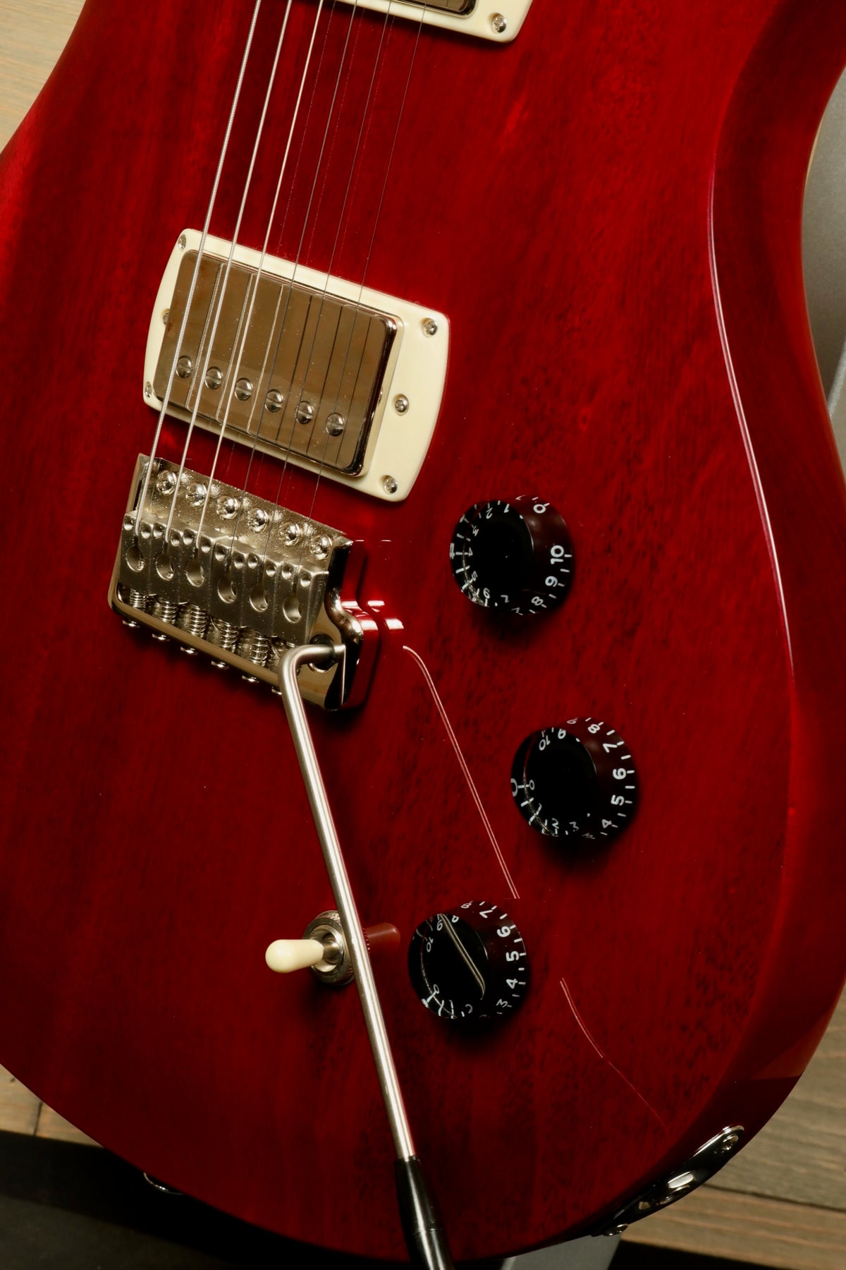 Close-up of PRS SE DGT Standard guitar showing the body, bridge, and control knobs