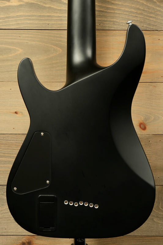 Back view of used Schecter Damien 7 Platinum guitar showcasing its sleek black finish and streamlined design