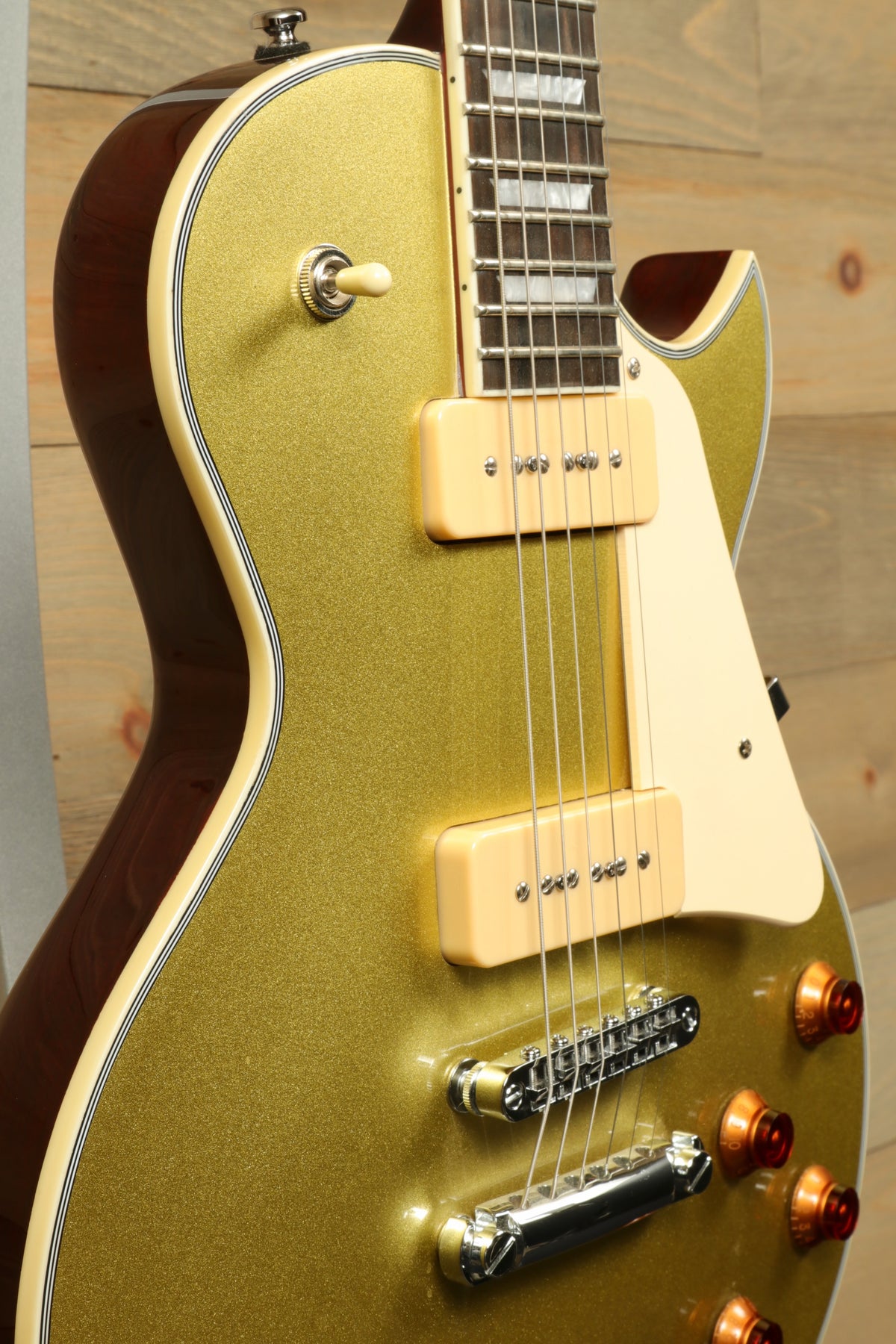Sire Electric Guitar Goldtop with a glossy gold finish, front view showcasing elegant design and features