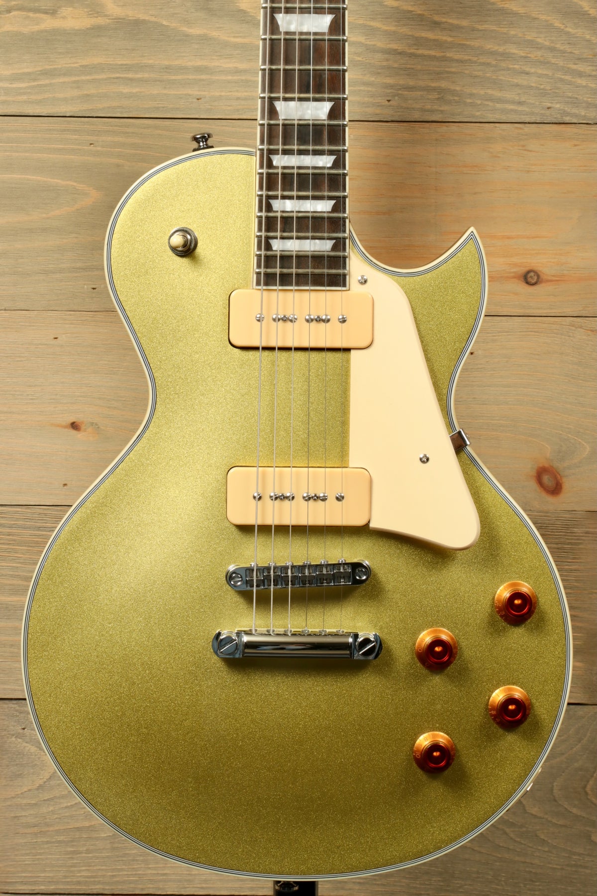 Sire Electric Guitar Goldtop with a glittery finish, front view showcasing dual pickups and orange knobs