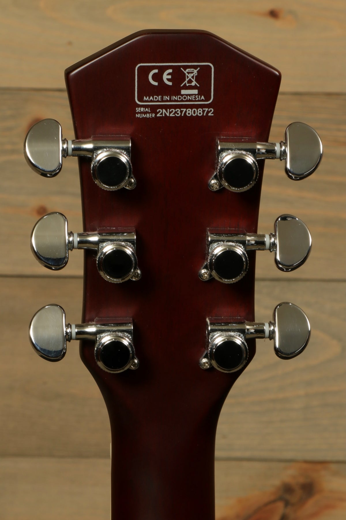 Sire Electric Guitar Goldtop, back view showing tuning pegs and neck finish.