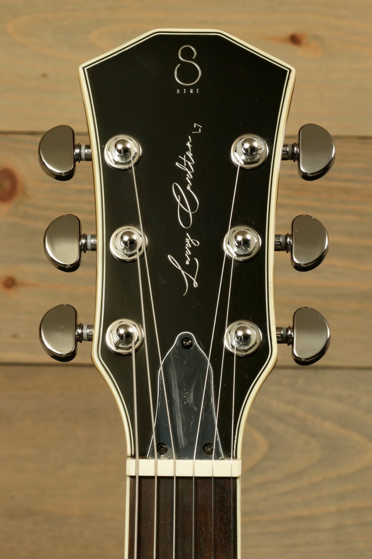 Sire Electric Guitar Goldtop, front view of headstock with sleek design and chrome tuners