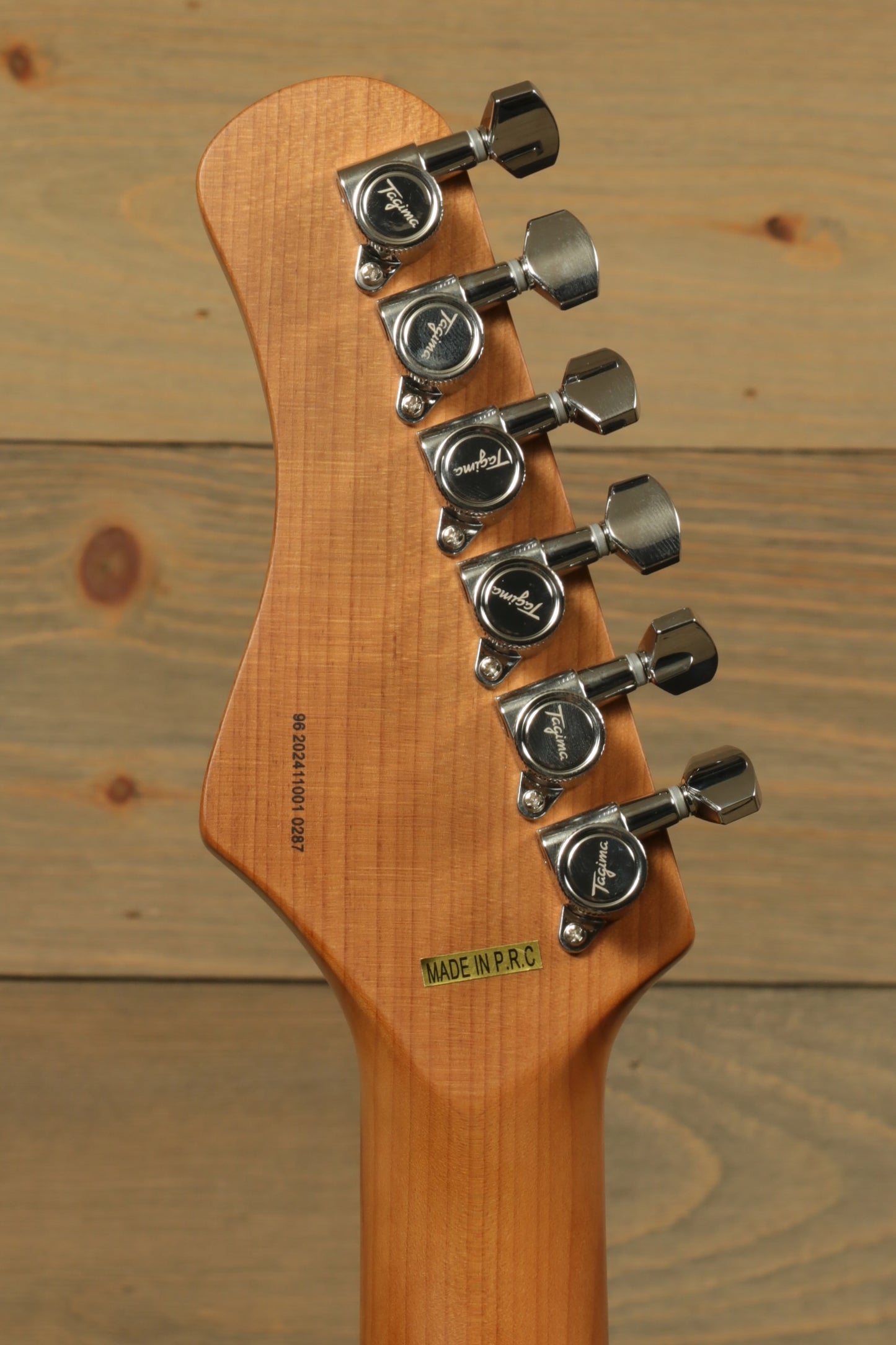 Tagima T 640 SUPER electric guitar, natural wood finish, headstock view with six tuning pegs