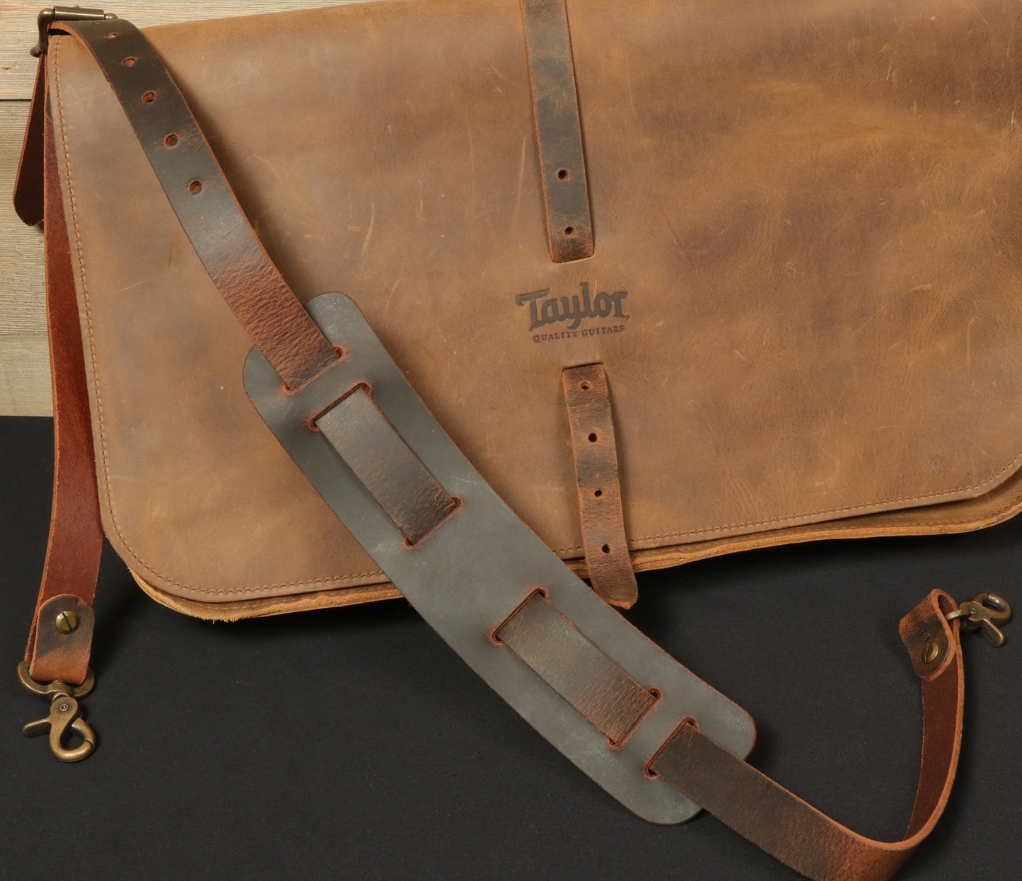 Taylor Guitars messenger bag with leather strap and rugged design for music enthusiasts