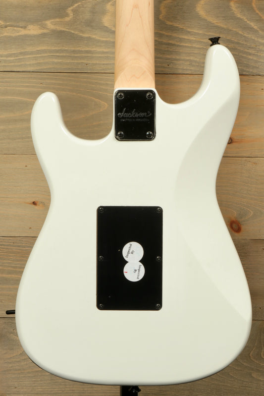 Back view of a used Jackson Adrian Smith guitar showcasing its sleek white finish and control layout