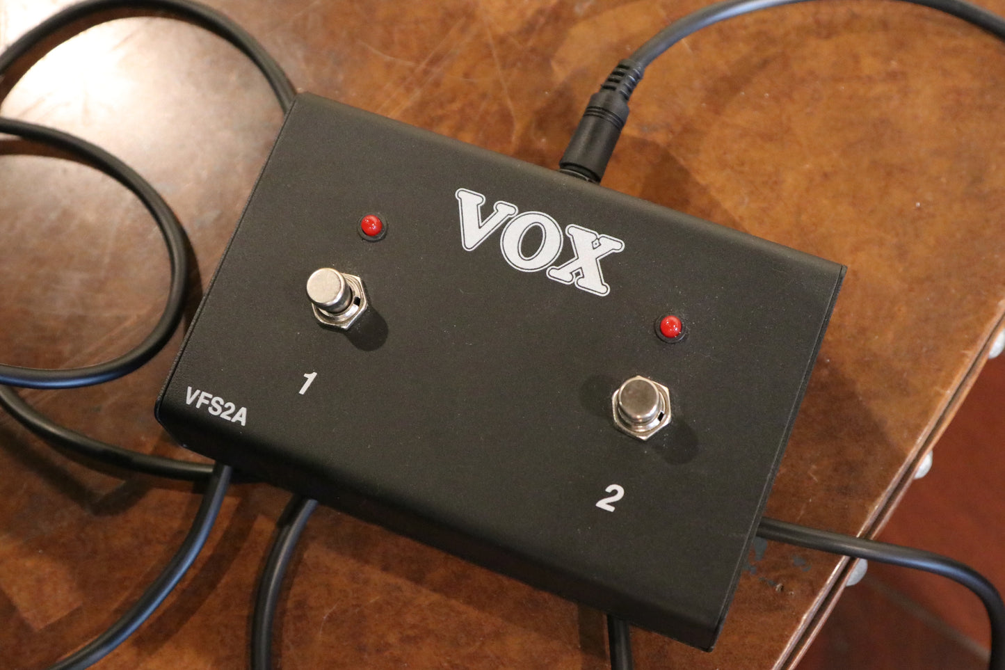 Vox AC15C2 2x12 Combo footswitch with two buttons, black finish, top view on table