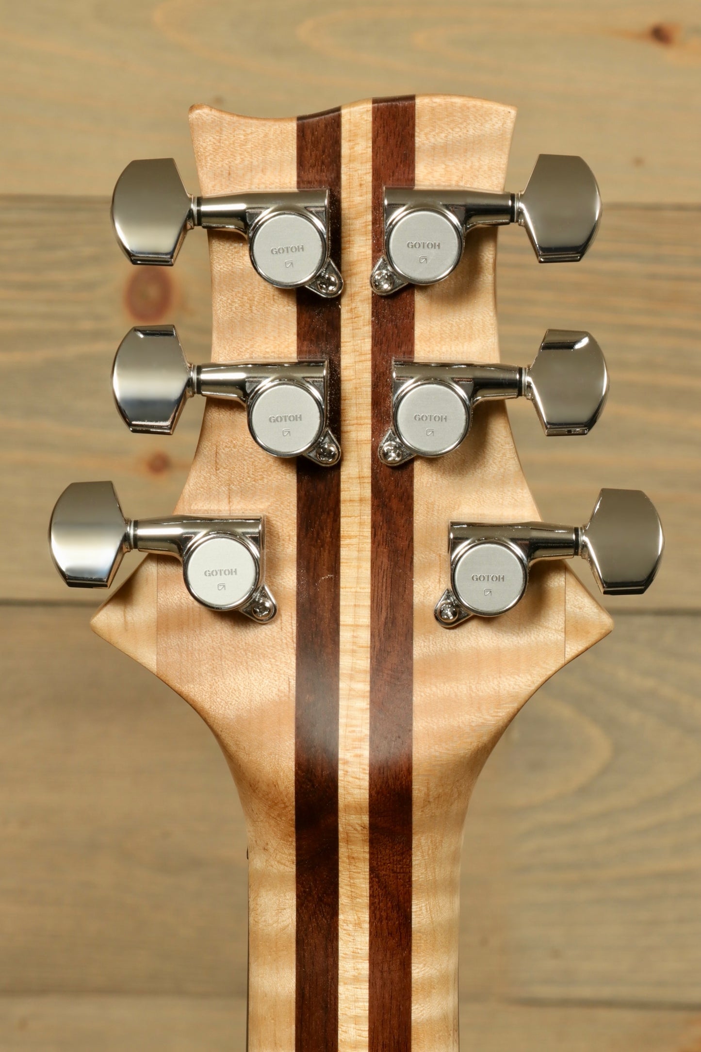 Back of Weller ElDorado electric guitar headstock showing chrome tuning pegs and wood grain finish