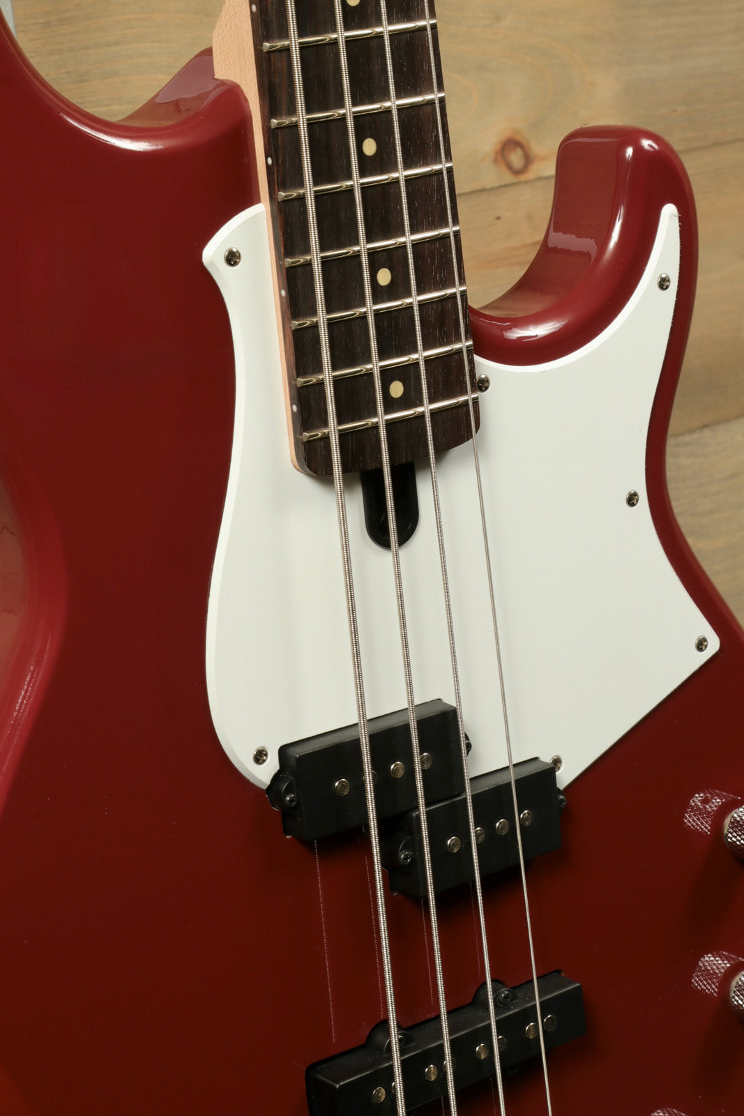 Yamaha BB234 4-String Electric Bass Guitar Raspberry Red, close-up view of body and neck