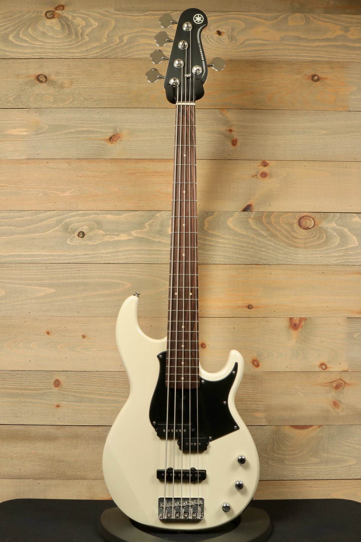 Yamaha BB235 5-String Electric Bass Guitar in white, front view against wooden background