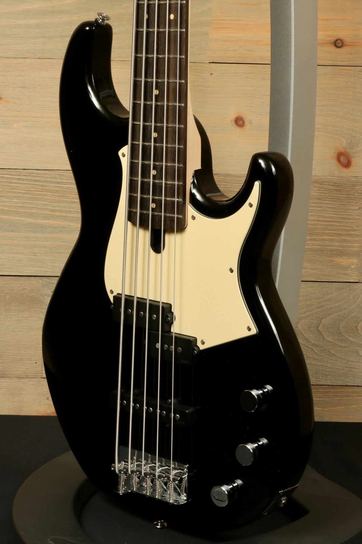 Yamaha BB435 5-String Electric Bass Guitar in black, front view with cream pickguard and knobs