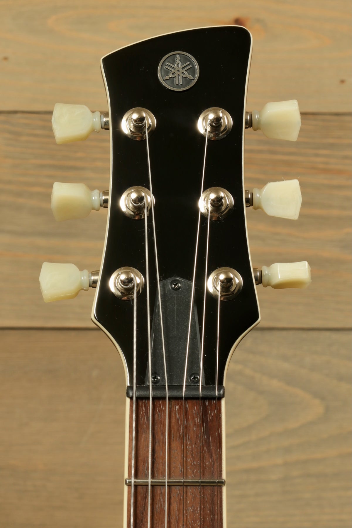 Yamaha Revstar Standard RSS20 headstock in black finish, top view showcasing tuning pegs