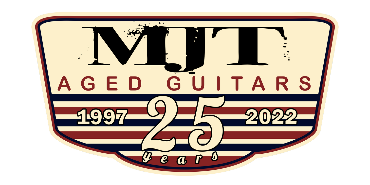 the logo for the 25th anniversary of mtt aged guitars