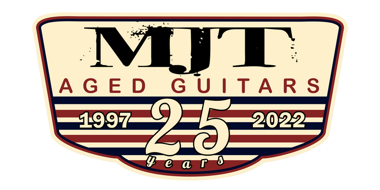 the logo for the 25th anniversary of mtt aged guitars