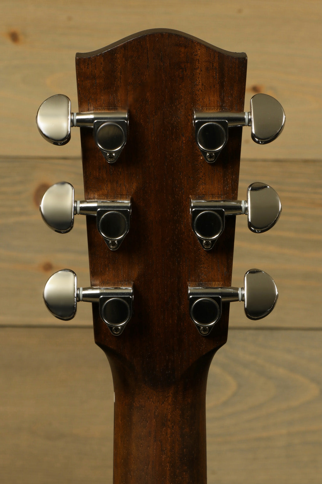 Eastman PCH2-OM-CLA acoustic guitar headstock in natural finish, rear view showcasing tuning pegs