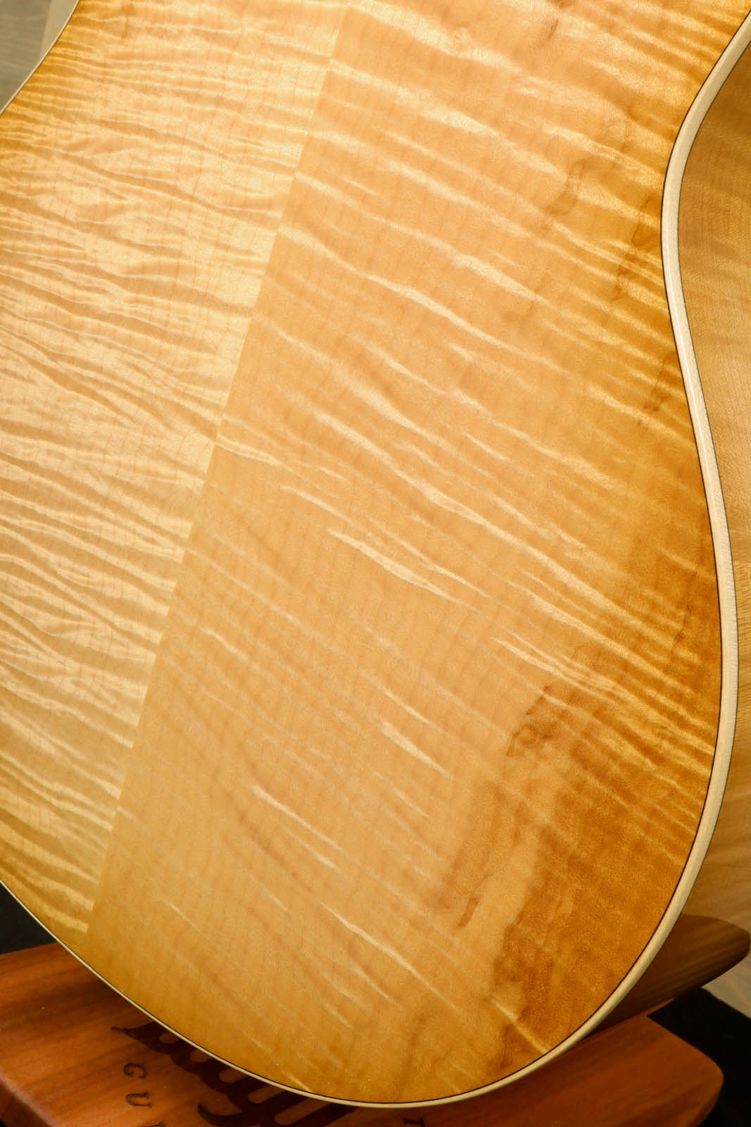 a close up of a wooden guitar neck