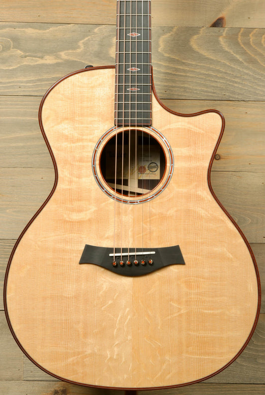 a wooden guitar hanging on a wooden wall