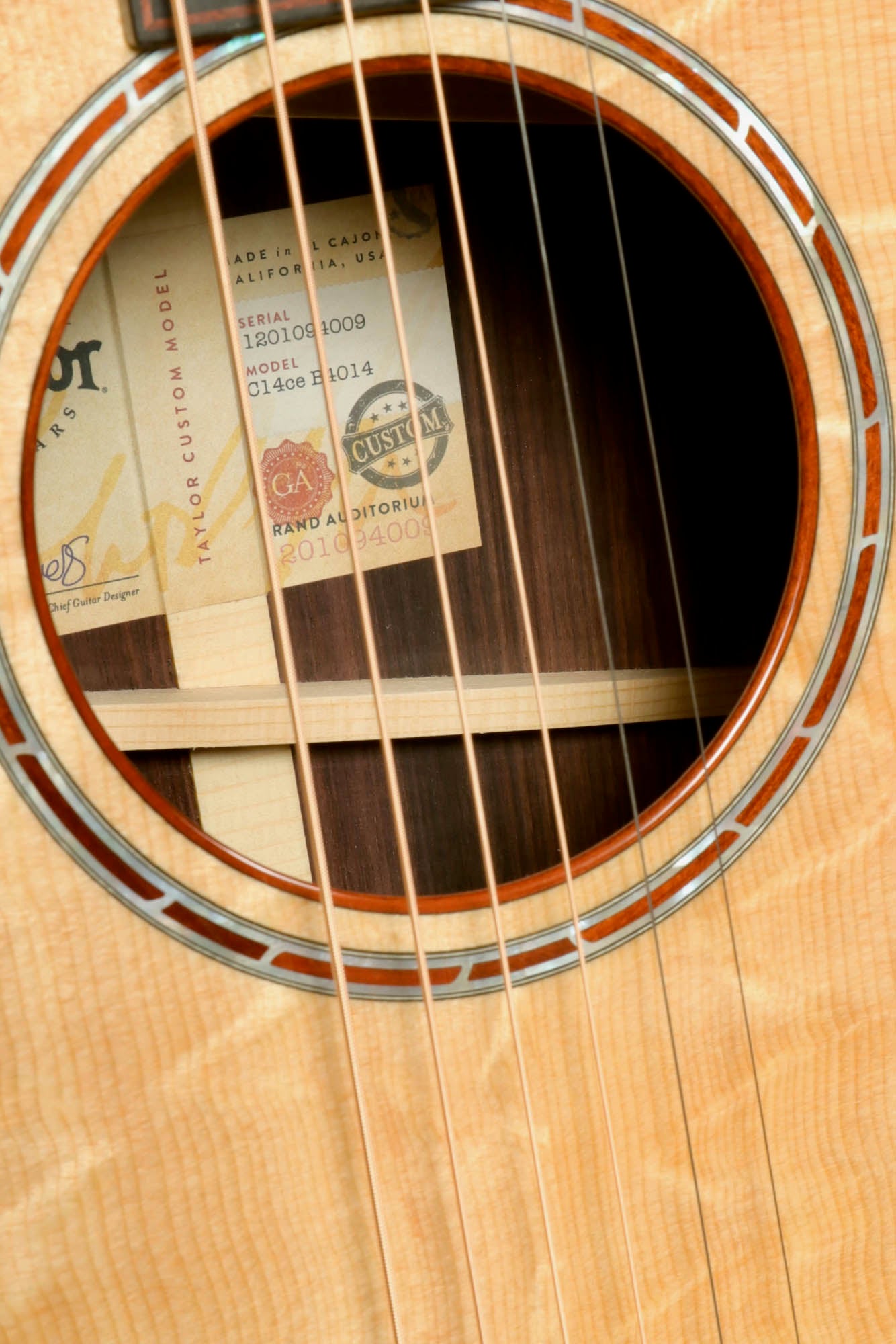 a close up of a guitar's frets and strings