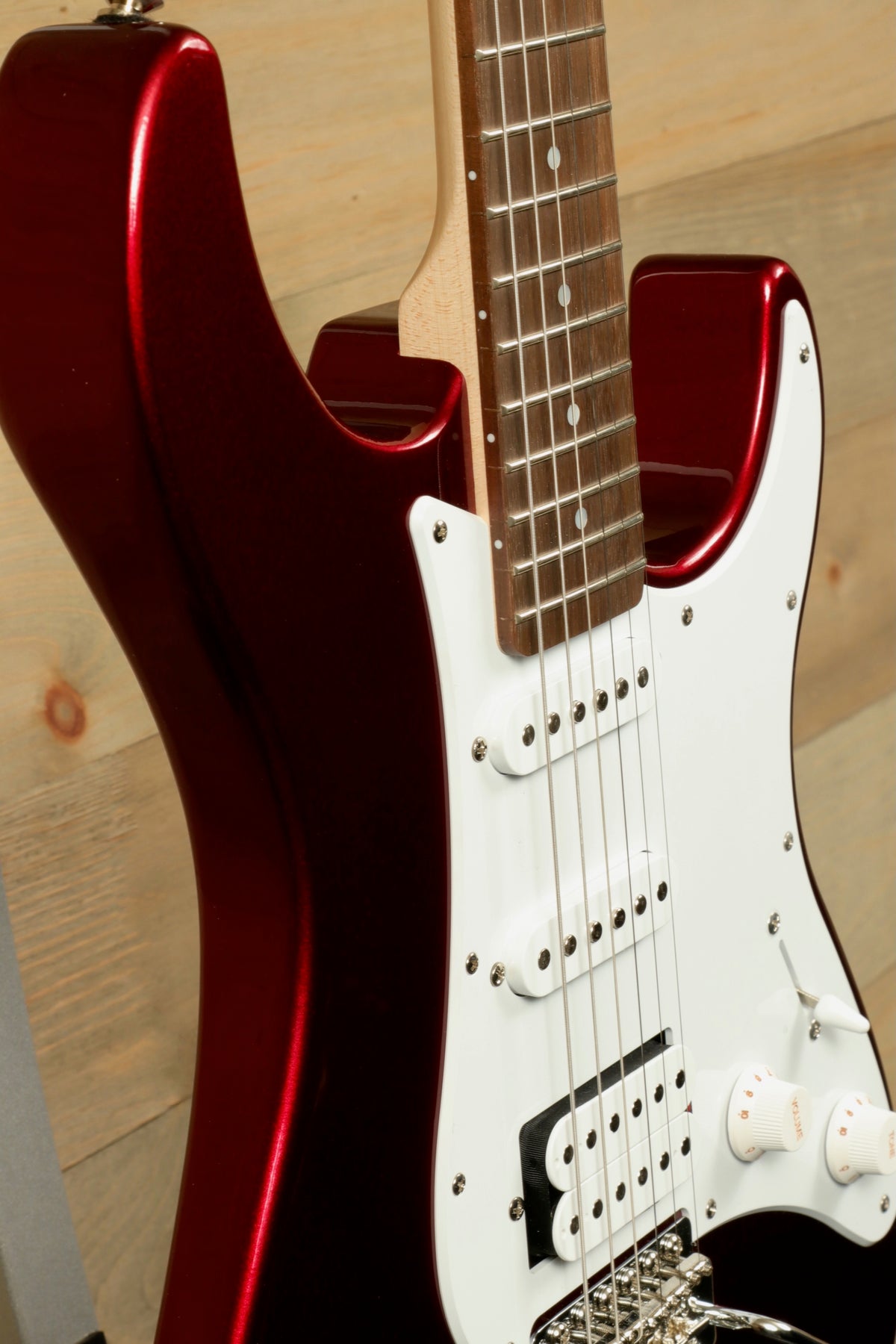 Yamaha PAC012 Pacifica Electric Guitar in shiny red finish, close-up view showcasing body and neck.