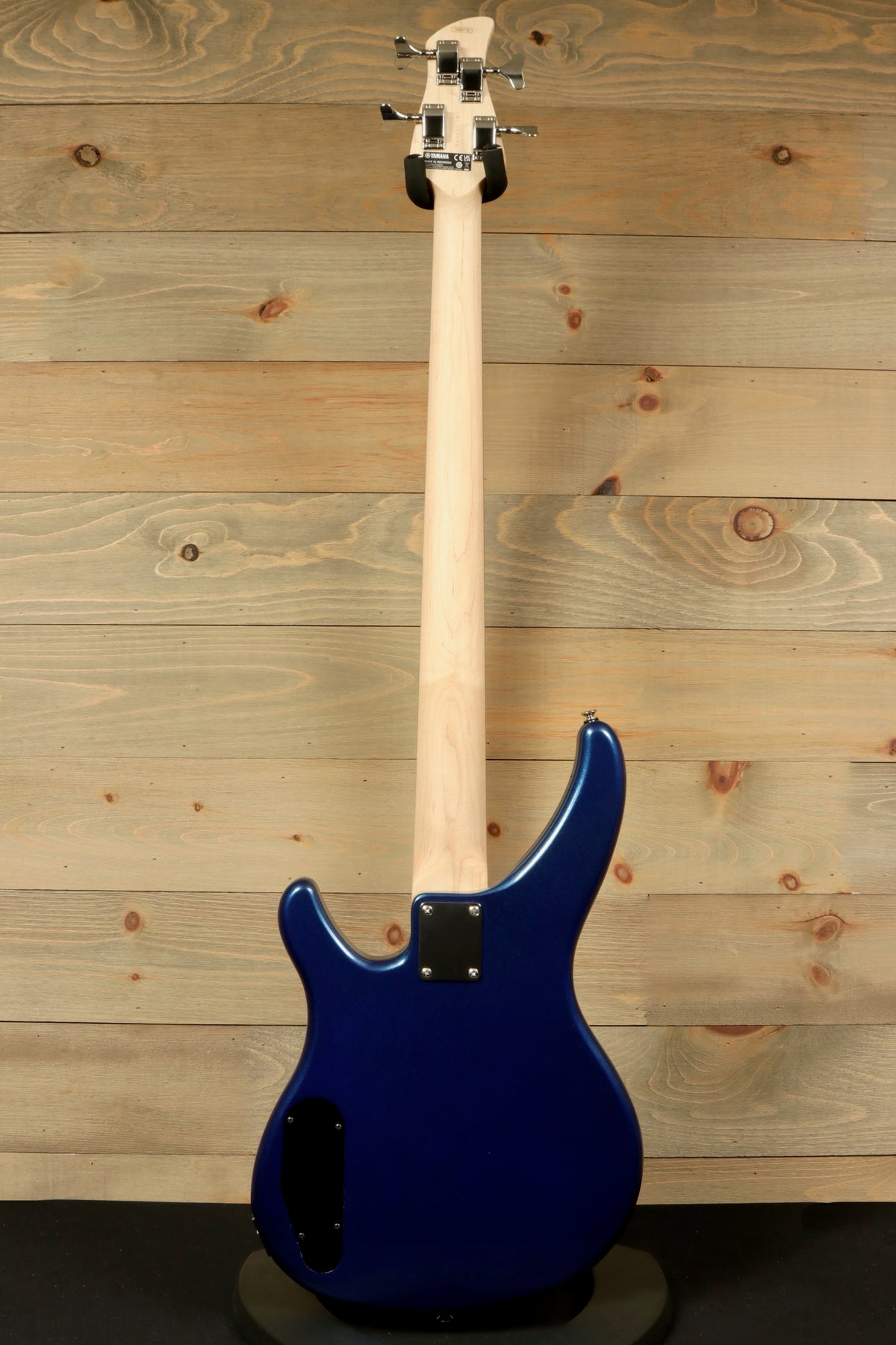 Yamaha TRBX174 blue bass guitar with a sleek body and a smooth neck, rear view