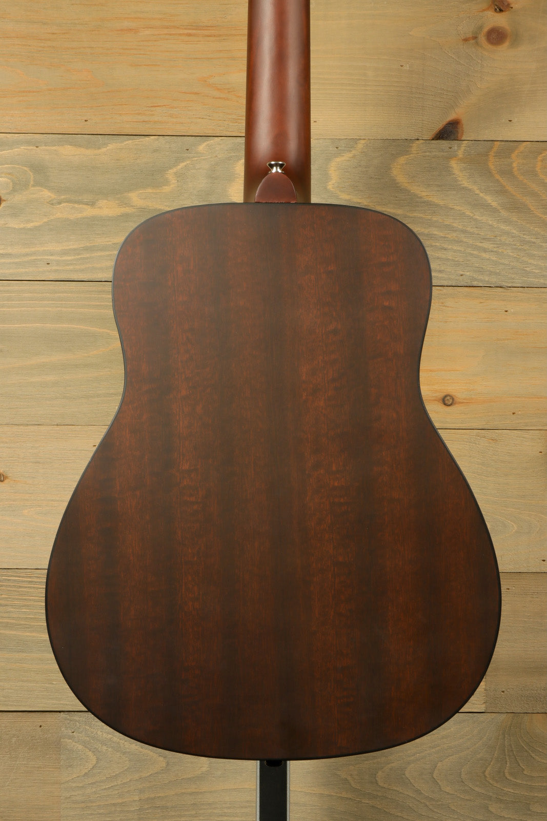 Yamaha acoustic guitar acoustic guitar with a dark wood finish, back view