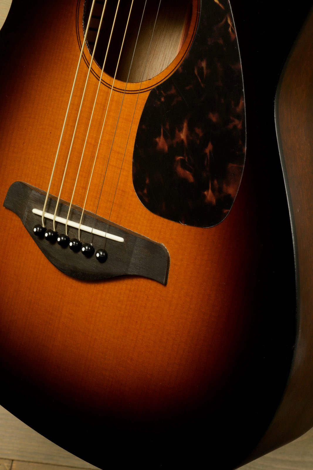 Yamaha acoustic guitar acoustic guitar in sunburst finish, close-up view of body and soundhole