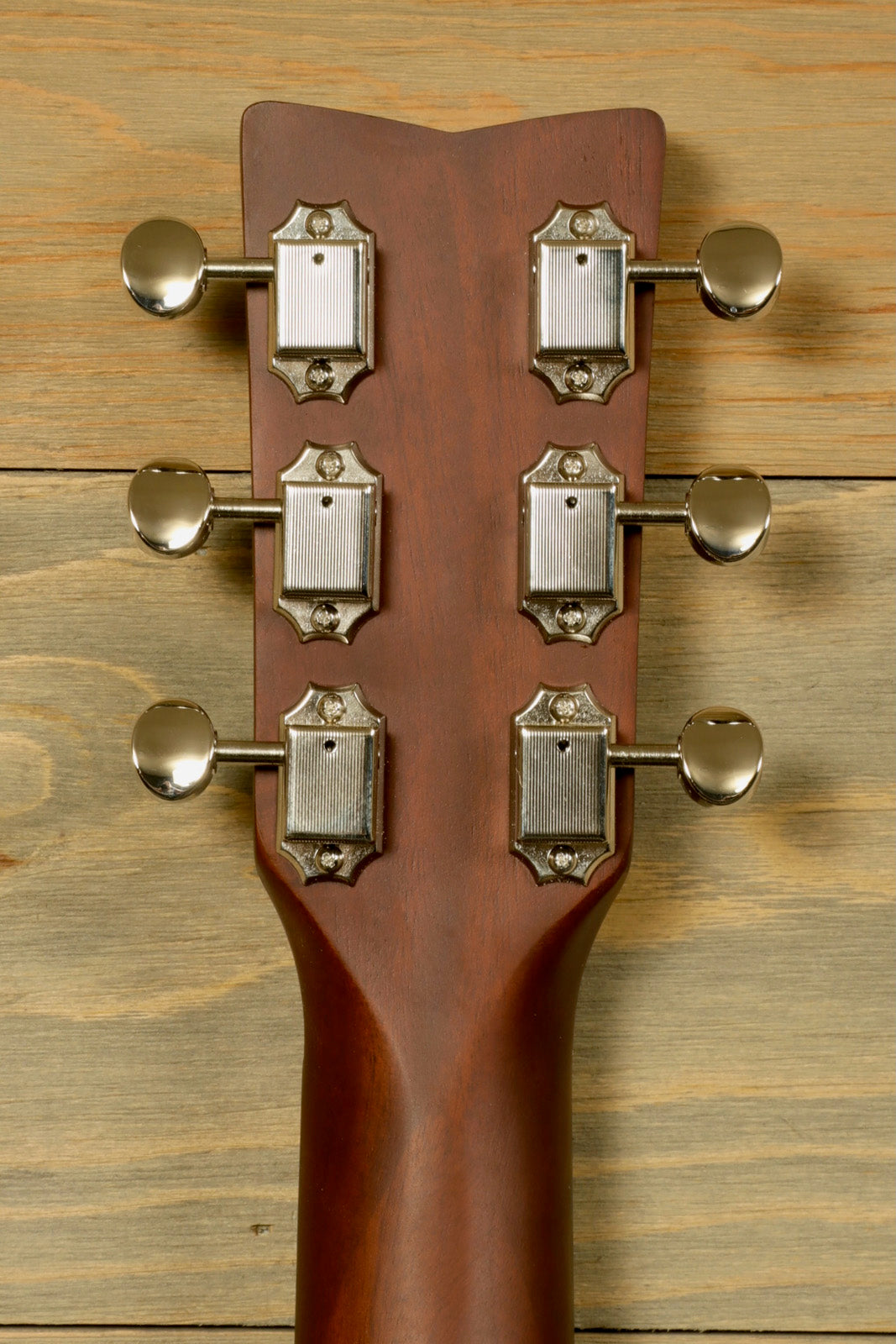 Yamaha acoustic guitar acoustic guitar, mahogany back with six tuning pegs, rear view