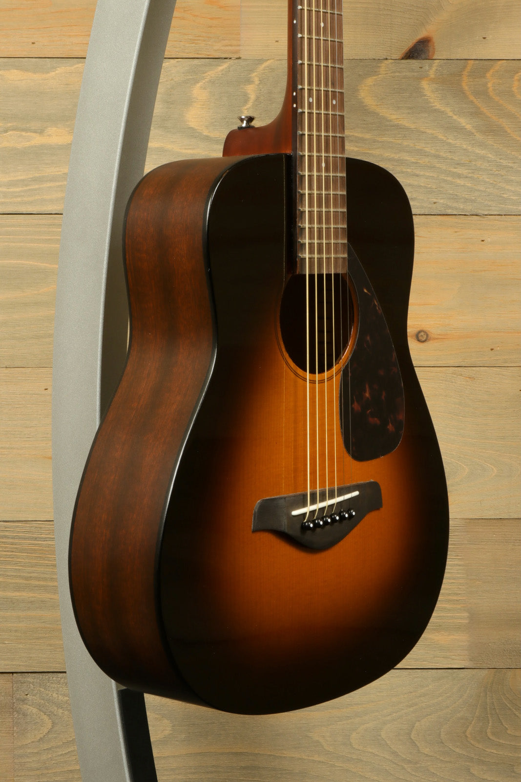 Yamaha acoustic guitar acoustic guitar, sunburst finish, side view showcasing the body shape.