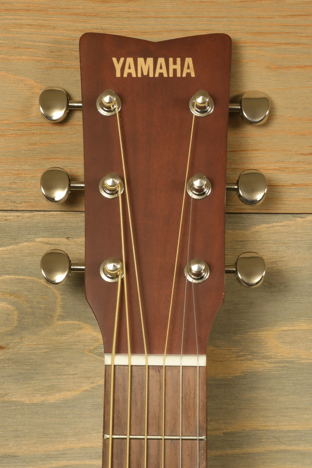 Yamaha acoustic guitar acoustic guitar, close-up view of the headstock with tuning pegs