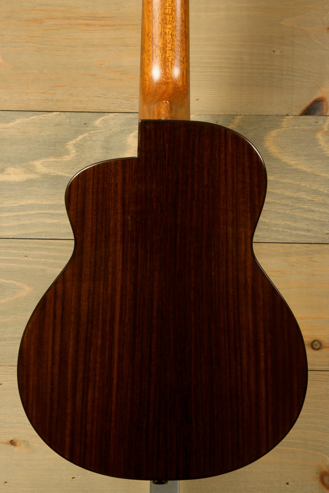 ANueNue UT200 ukulele back view in dark wood finish showcasing elegant grain pattern