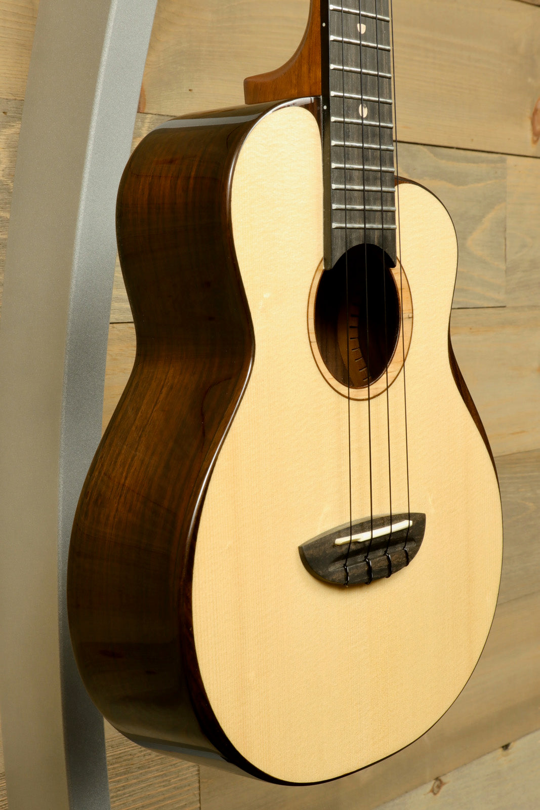 ANueNue UT200 ukulele in natural finish, side view showcasing its elegant design and craftsmanship
