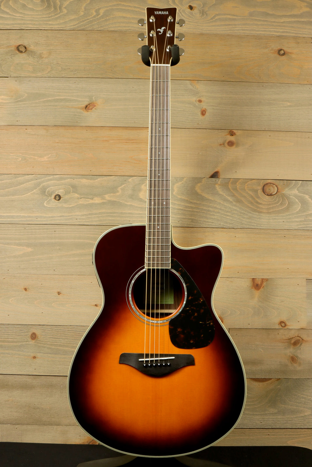 Yamaha acoustic electric guitar in sunburst finish, front view showcasing body and neck design