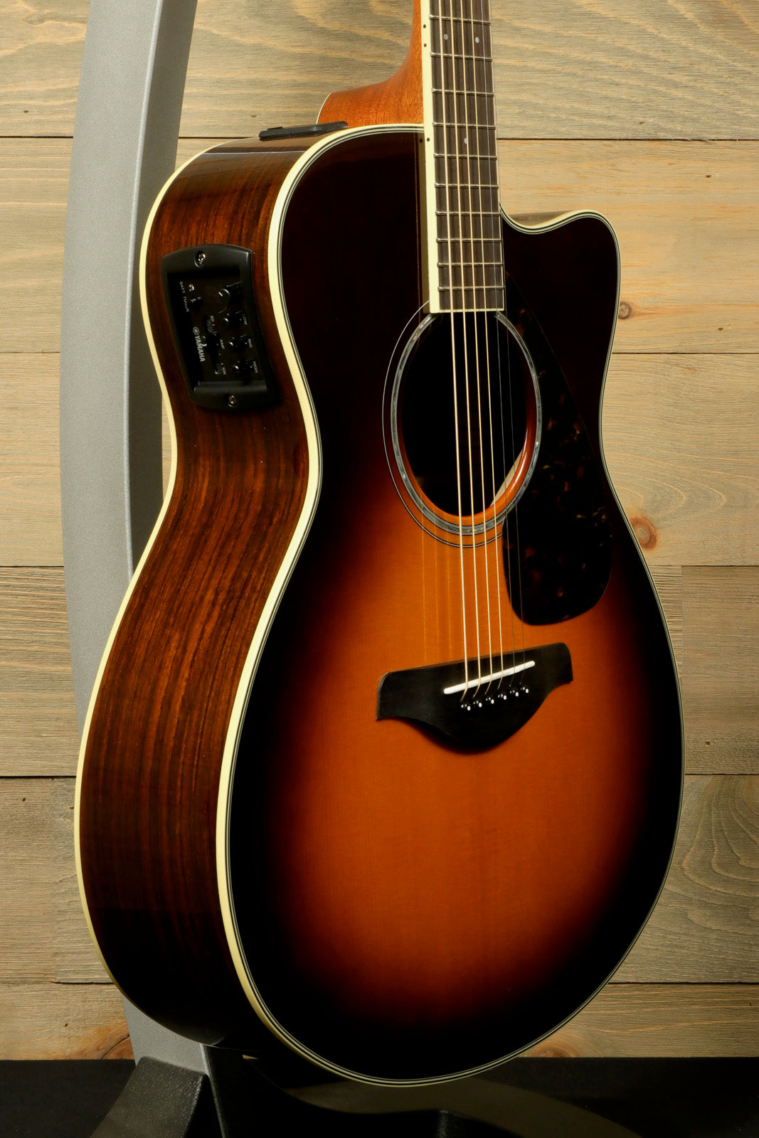 Yamaha acoustic guitars electric, sunburst finish, side view showcasing body and controls
