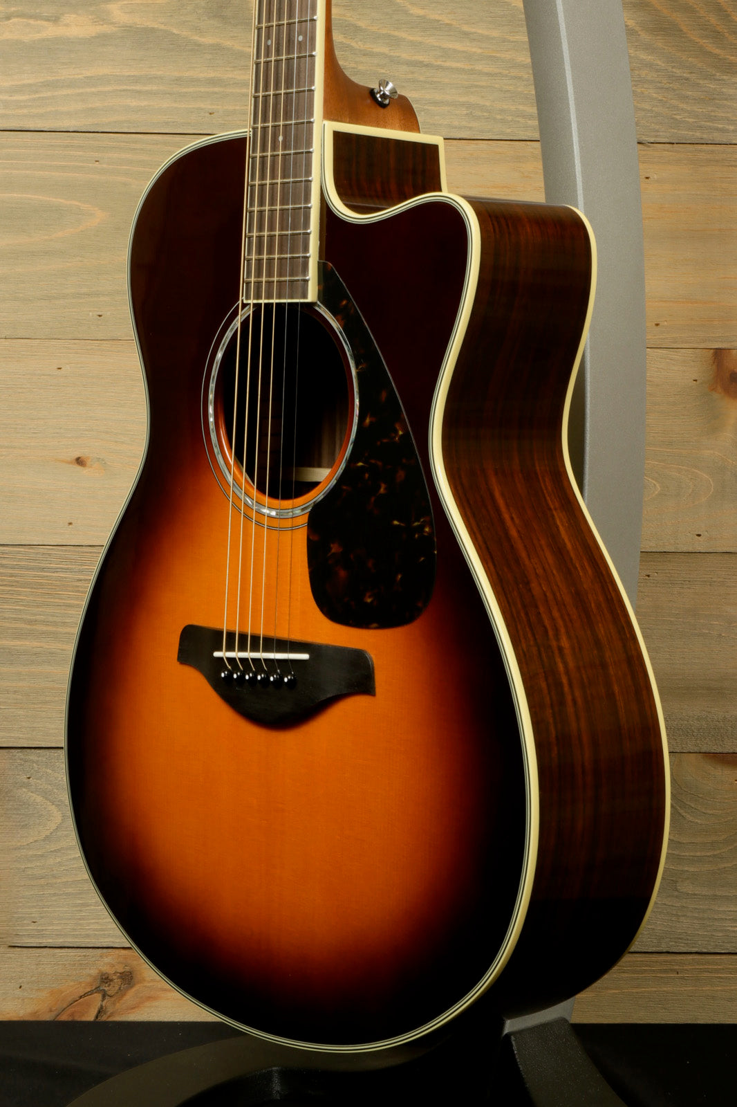 Yamaha acoustic electric guitar in sunburst finish, showcasing a smooth body and elegant design