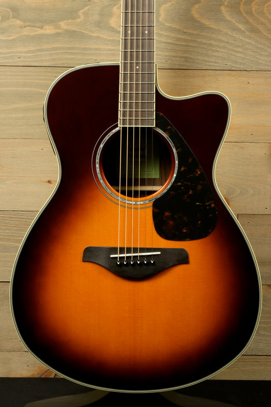 Yamaha acoustic electric guitar, sunburst finish, front view showcasing body and strings