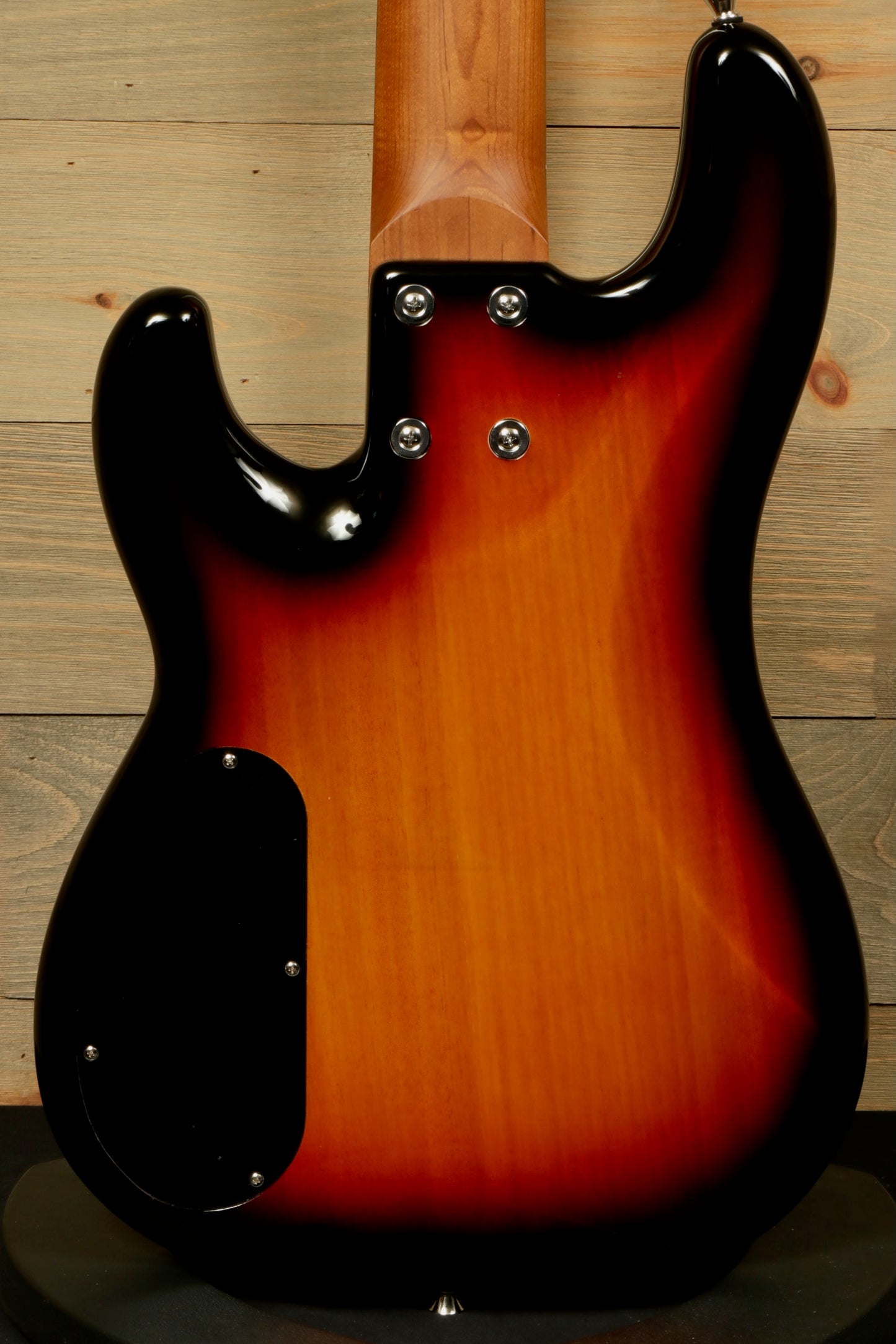 Tagima 5 string bass guitar, sunburst finish, back view with smooth contours and quality craftsmanship