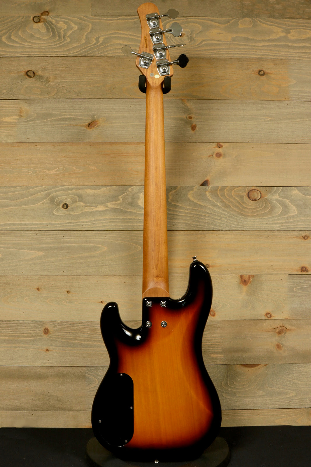 Tagima bass guitar 5 string in sunburst finish, back view showing the neck and body